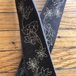 Brown belt with gold stitching